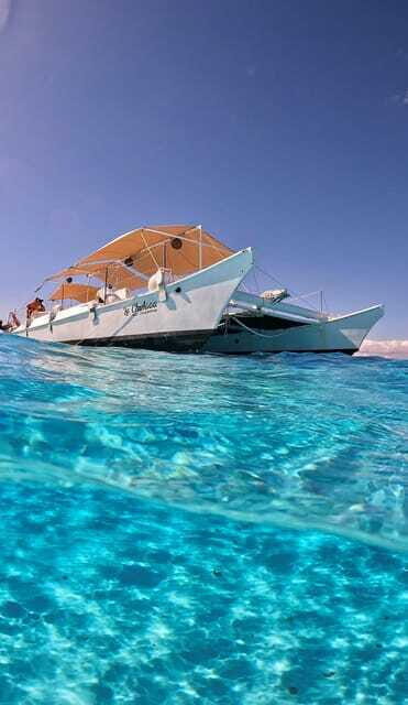 4 Hour Turtle Sanctuary Experience on a Luxury Catamarán - El Cielo starfish sanctuary: white sand + red and orange dots