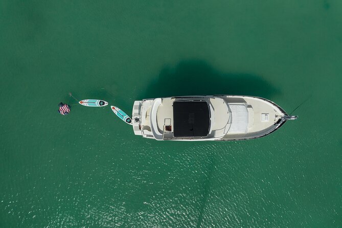 4 Hours - 53' Hatteras - Tulum, Playa Del Carmen, Riviera Maya - Onboard Fun: Karaoke and Music Without the Awkwardness