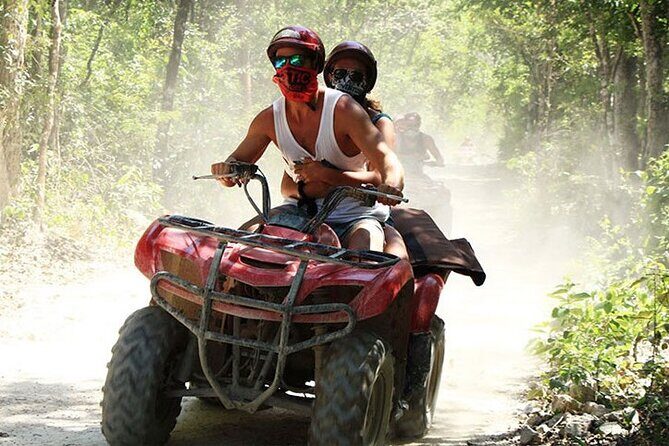 ATV Cenote and Zipline Adventure from Tulum - Riding the ATV through Mayan countryside dirt and roots