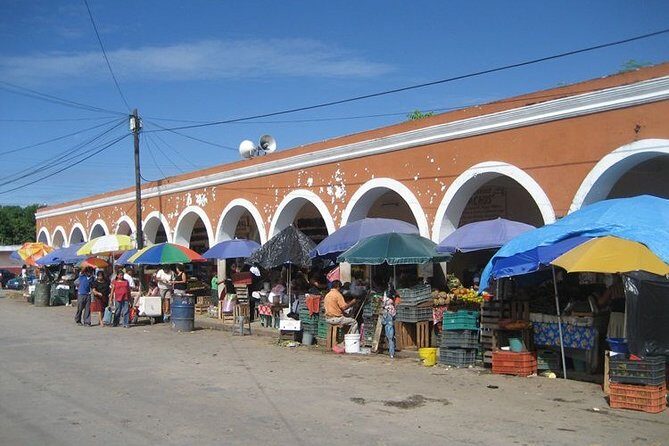 Biketour Valladolid: local Market - Cenotes - Mayan Families - Mercado Municipal: tamales, fruit, and quick local color