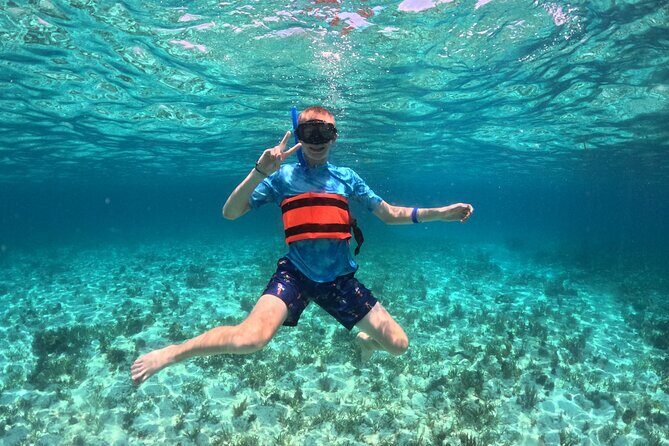 Cancun Catamaran: Sail to Isla Mujeres + Buffet & Drinks - Stop 1: Playa Tortugas to the First Snorkeling Moment
