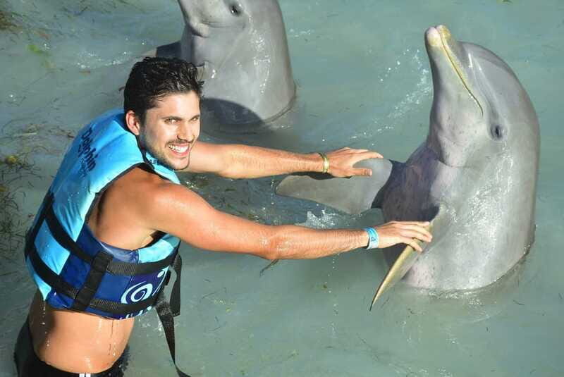 Cancun: Dolphin Encounter on Isla Mujeres and Garrafon Park - Beach club buffet, lockers, and the one zipline ride