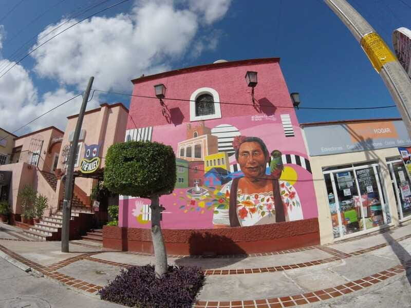Cancun: Guided City Tour with Shopping by Double Decker Bus - Playa Delfines, El Mirador, and the Cancun sign photo moment