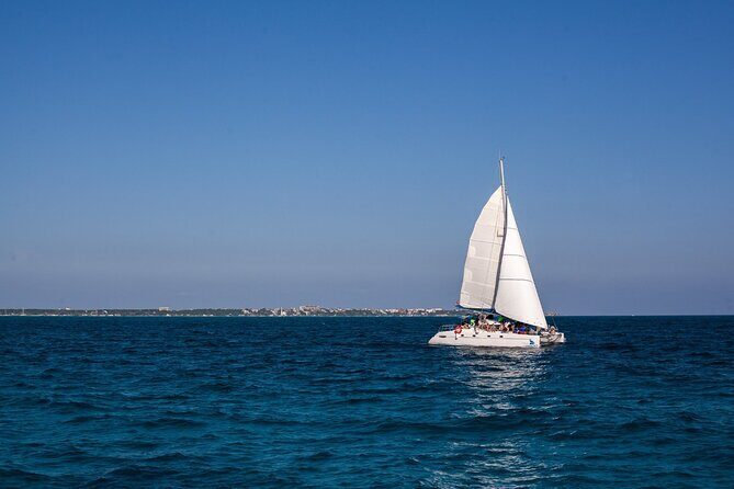 Cancun Sailing Catamaran Islas Mujeres With Luxury Beach Club - Price and What You Actually Get for $76