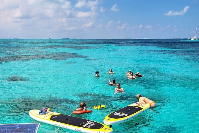 Cancun to Isla Mujeres Private Catamaran Cruising Snorkeling Fun! - Isla Mujeres sailing time: open bar, favorite music, and a calmer pace