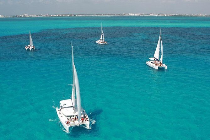 Catamaran adventure to Isla Mujeres with Snorkel,Buffet,Open Bar and Beach Club - Isla Mujeres Arrival and the Playa Norte Advantage