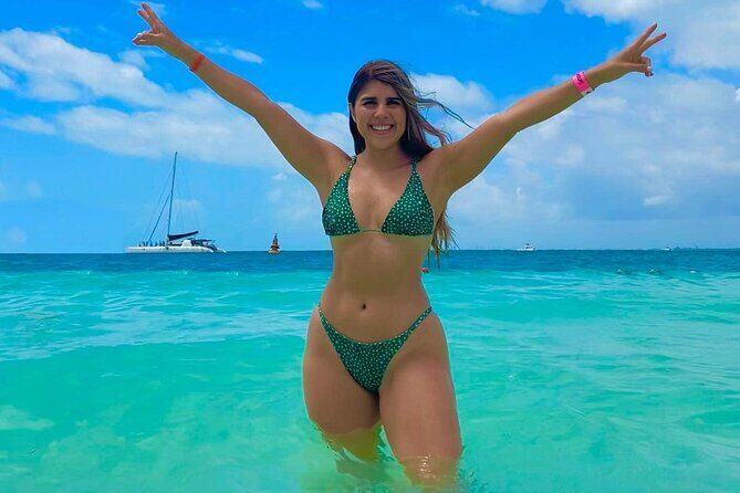 Catamaran Adventure Tour Isla Mujeres Unlimited from Cancun with Transportation - Isla Mujeres First Stop: Snorkeling Route, Beach Club, and Island Time