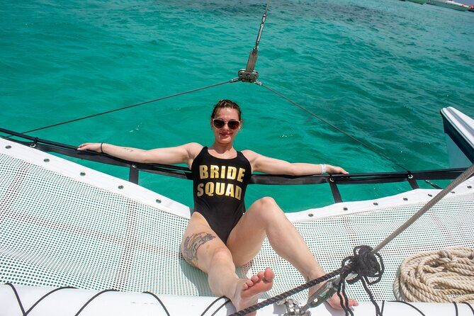 Catamaran Cancun to Isla mujeres Lunch OpenBar and Snorkeling - Playa Norte Beach Club: Clear Water, Small Fish, and the Clock