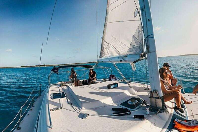 Catamaran party Isla Mujeres with drinks & lunch - On the Water: Open Bar, Music, Scenic Views, and Snorkeling