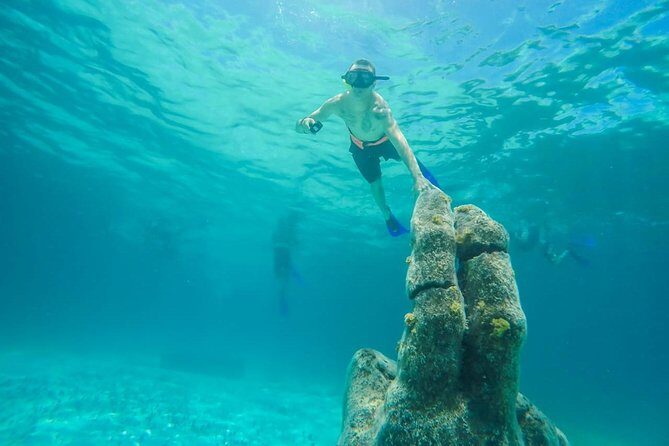 Catamaran Sailing & Snorkeling Experience Isla Mujeres from Playa Del Carmen - Isla Mujeres downtown and Calle Hidalgo: quick shopping and food browsing