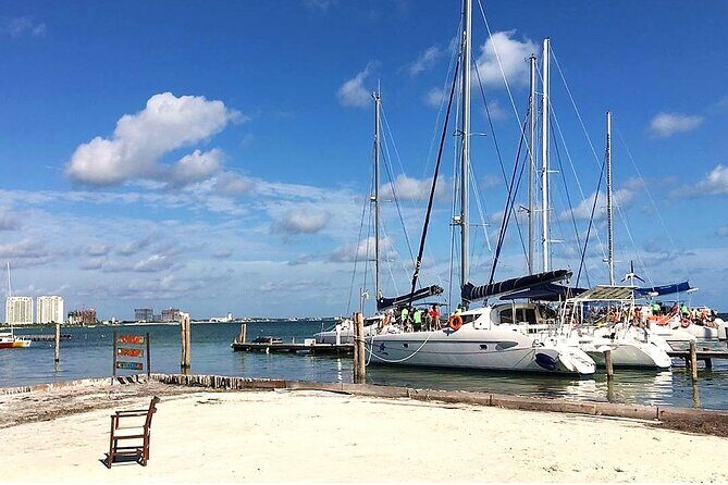 Catamaran to Isla Mujeres, Open bar, buffet, Beach Club Included - Dock Fee and Transport: The Few Extra Costs to Budget