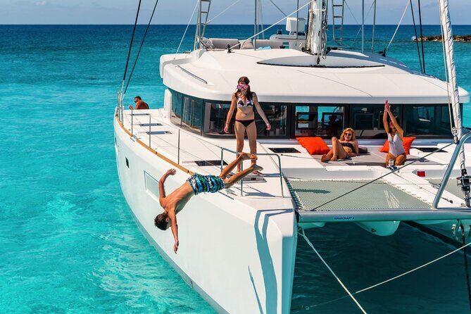 Catamaran Tour to Isla Mujeres from Cancún with Bar and Lunch - Beach club time and Mexican buffet: where the trip slows down
