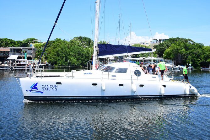 Catamaran Tour to Isla Mujeres, Open bar, Lunch, Snorkeling, Beach Club Included - On-board vibe: crew energy, games, and party pacing