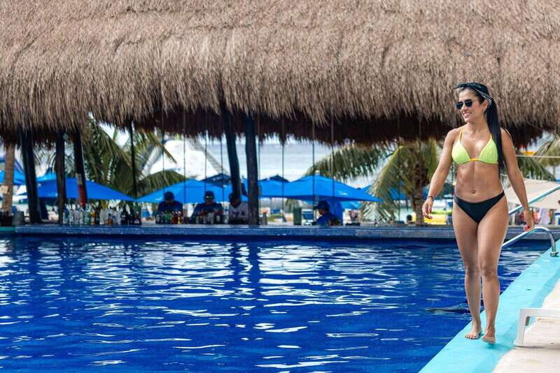 Cozumel: Best Day Pass at San Francisco Fun Beach Club - Beach setup: lounge chairs, umbrellas, and a locker that actually helps
