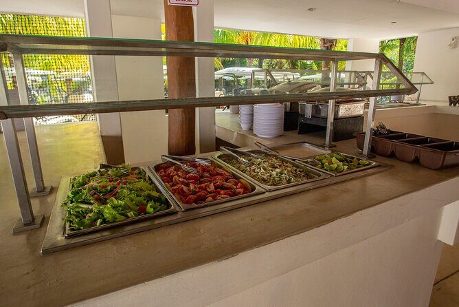 Deluxe Catamaran tour to Isla Mujeres with Open Bar and Lunch - Cruising to the reef with open bar and easy music
