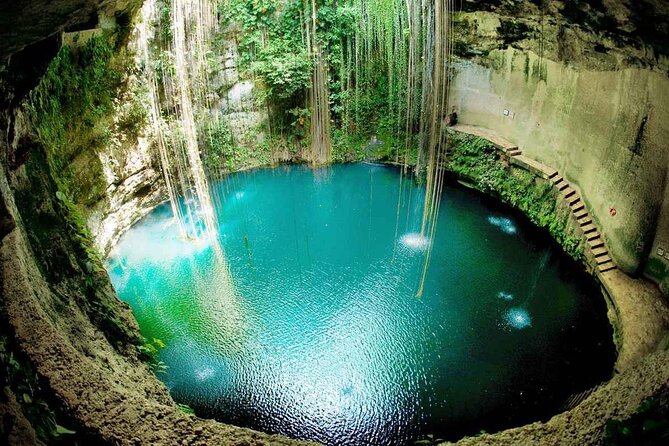 Discover and Descend on the Hidden Xenotes Tour From Cancun - K’áak’ Cenote (Fire): Kayak across sunlit water