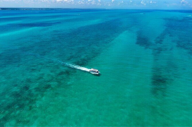Discovering Isla Mujeres on a Double Decker Catamaran - Getting There: Cancun Lighthouse Meeting Point and Transfer Reality