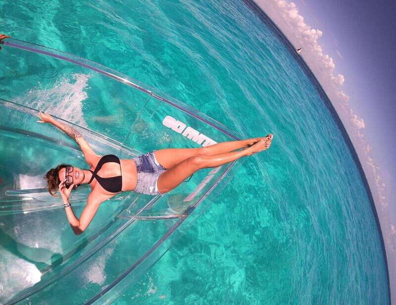 Explore the sea of cozumel in a transprent boat with drinks and snorkel. - Key highlights at a glance