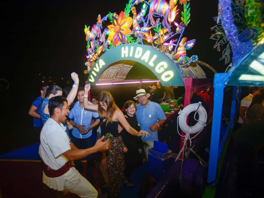 From Cancun: All-Inclusive Xoximilco Park Admission - Entering the fair: sweets, dance shows, and a host who keeps it moving