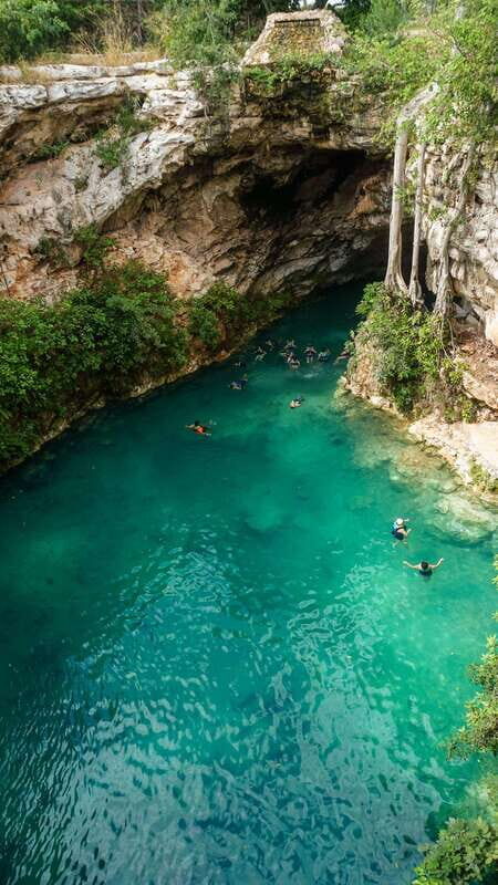 From Merida: 3 Cenotes - Inside Cenote Santa Barbara: stairs, elevator access, and turquoise clarity