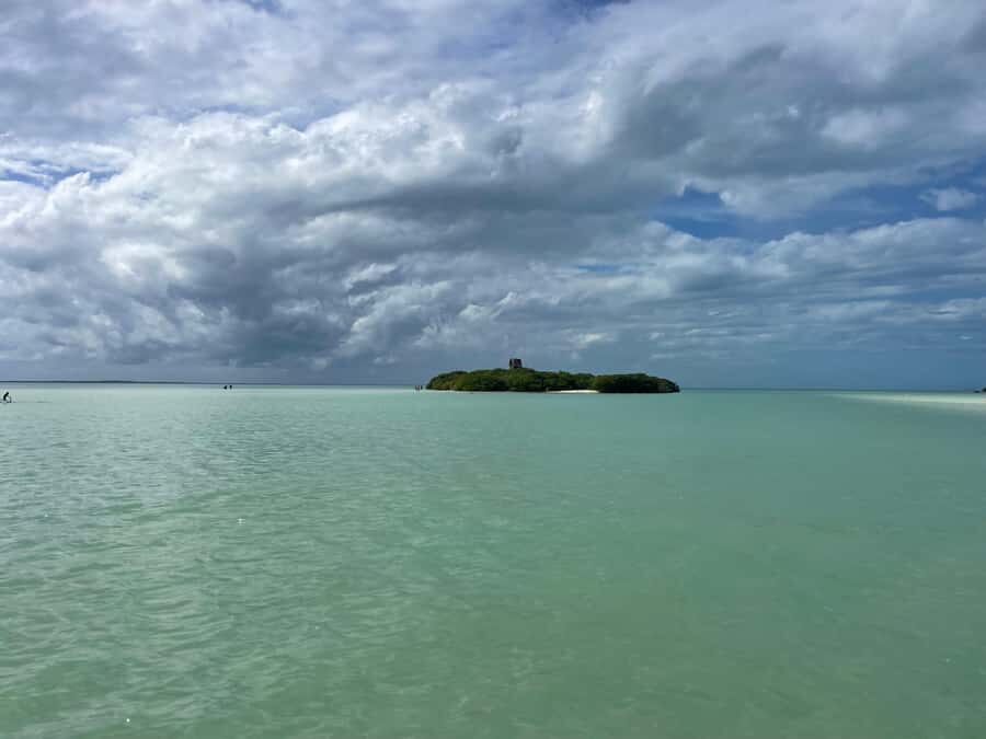 Holbox: Punta Mosquitos, Yalahau, & Pasión Island Boat Tour - Getting there: pickup, golf cart transfer, and the boats