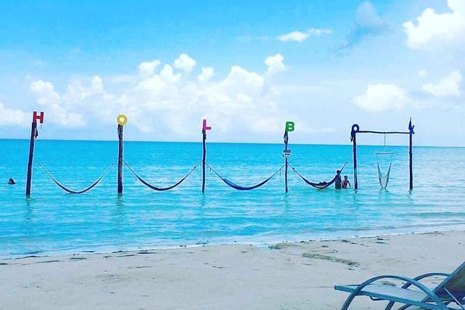 Isla Holbox All Inclusive with Transportation (Breakfast and Food Included) - Holbox Island time: Playa Hermosa, sandy streets, and optional golf cart touring