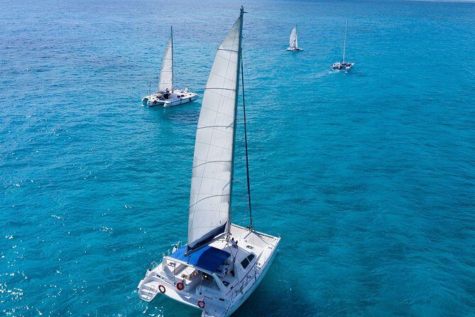 Isla Mujeres All Inclusive Sailboat Experience - Boat style, group size, and the party-friendly vibe