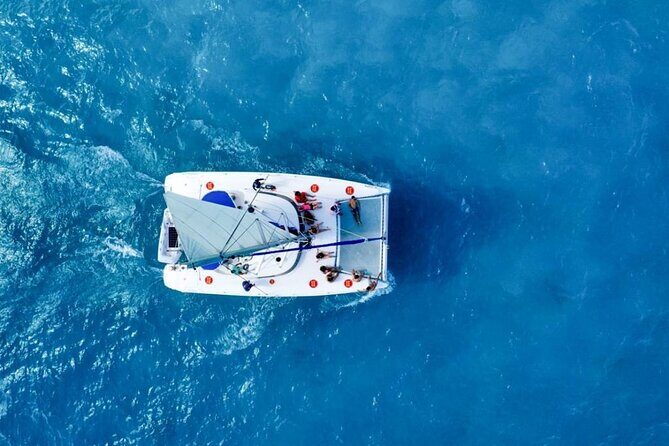 Isla Mujeres: Catamaran Tour with Snorkeling Food, Drinks, Beach - Snorkeling at the beach stop: gear is included, but plan for shorter reef time