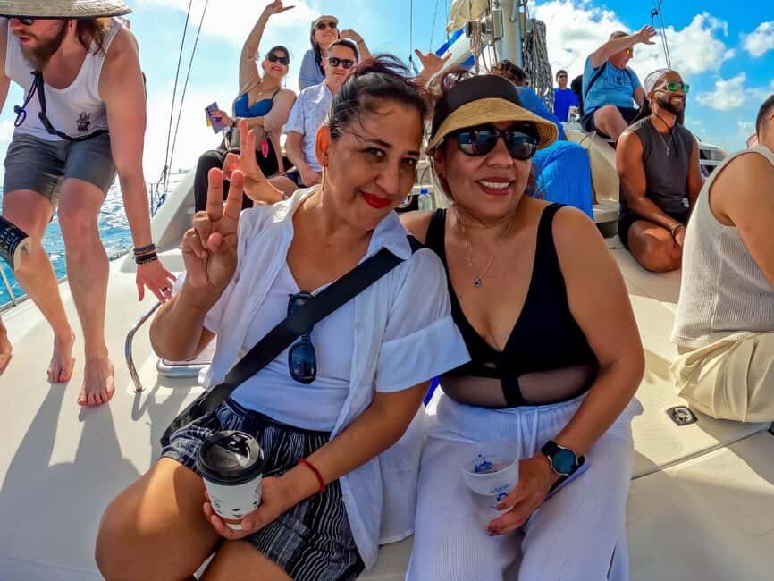 Isla Mujeres Catamaran Tour with Snorkeling & Open bar - Spinaker flight and return party mood: how the day changes with conditions