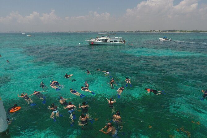 Isla Mujeres Full Day Tour on Yacht with Snorkel and Buffet - Isla Mujeres Time: Playa Norte Freedom Plus Downtown Exploring