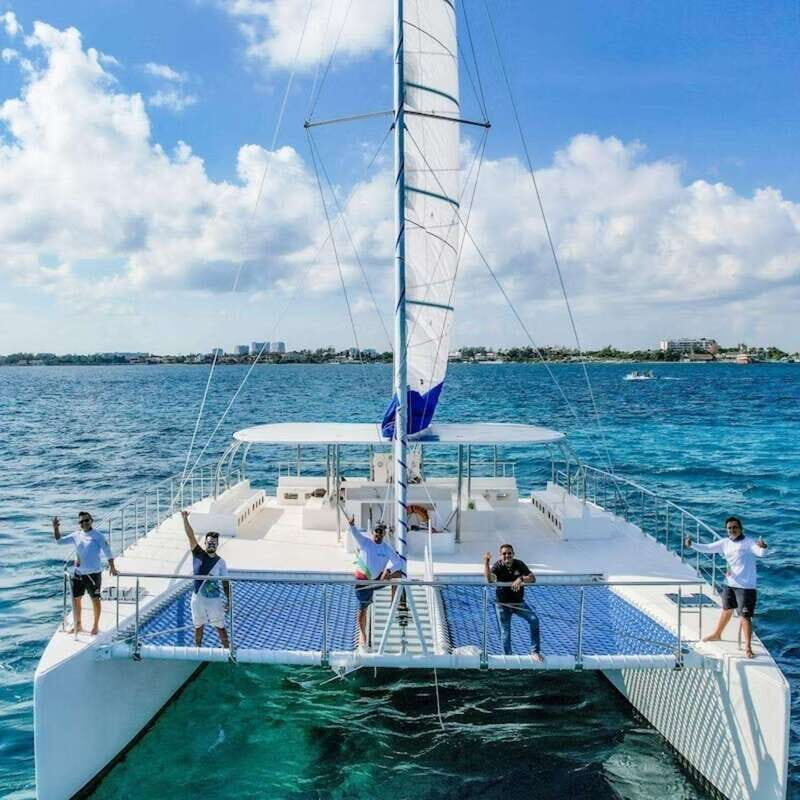 Isla Mujeres Plus Experience Catamaran Tour + Snorkel+Lunch - The Sunset Return and the Spinnaker Moment (If the Wind Helps)