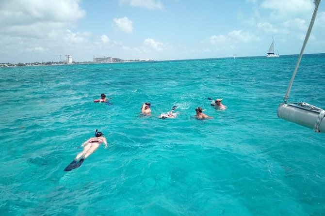 Isla Mujeres Premium Catamaran Tour with transportation from Playa del Carmen - Getting to the port: pickup timing from Playa del Carmen