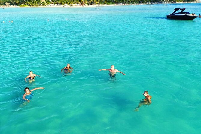 Isla Mujeres Premium Tour in Private Catamaran with Lunch - The staff and guide: how the day stays on track