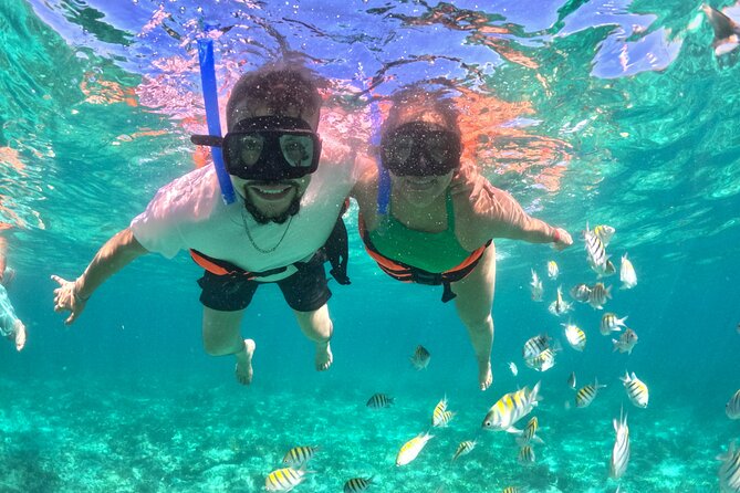 Isla Mujeres Spring Break Party Catamaran Snorkel and Open Bar - Beach time at Playa Norte and Playa Centro: two different moods