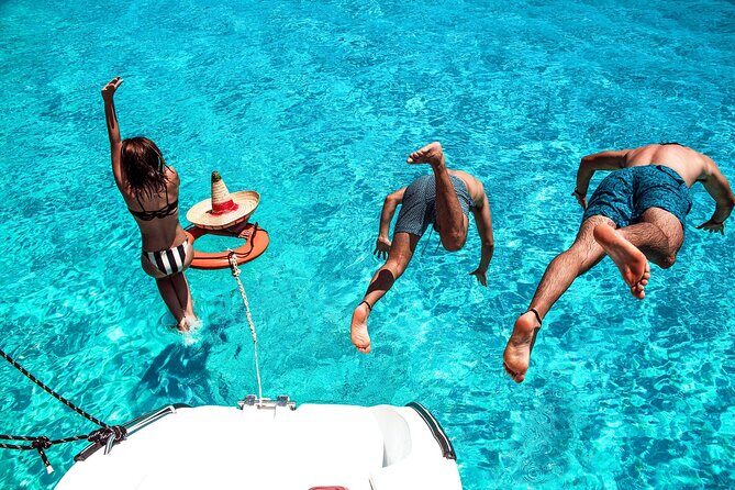 Isla Mujeres Tour on Catamaran with Snorkel, Open Bar, Buffet & Beach club - Sailing to Isla Mujeres: Caribbean Time With Planned Stops