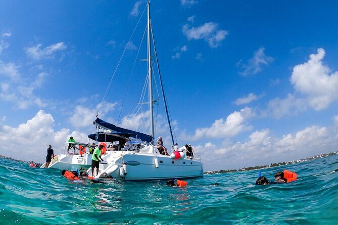Isla Mujeres Tour on Catamaran with Snorkel, Open Bar, Buffet & Beach club - Isla Mujeres Free Time: Murals, Monuments, and Your Own Pace