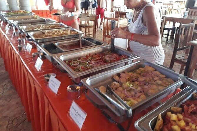 Isla Mujeres Unlimited Catamaran! Drinks, Fun & Party From Playa Del Carmen - Beach club break on Isla Mujeres: loungers, buffet, and downtime