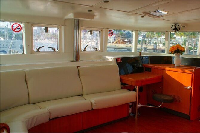 Luxury Catamaran Tour to Isla Mujeres with Transportation - Isla Mujeres Return and Sunset Sailing: Music, Drinks, and Optional Spinnaker