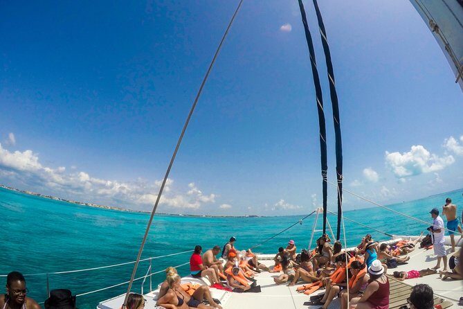 Mujeres Island Tour by Catamaran from Cancun City - Drinks and onboard extras: open bar, plus possible photo sales