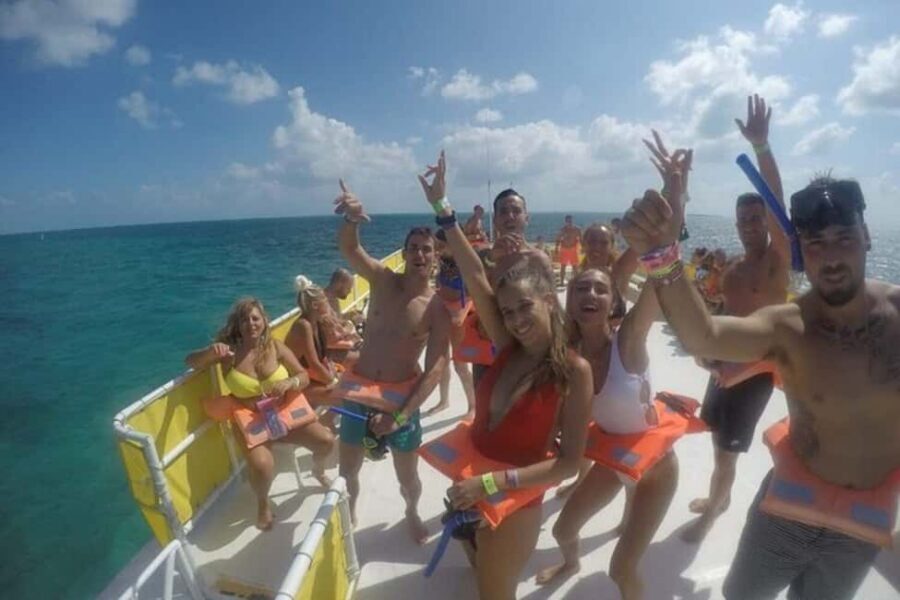 PDC: Isla Mujeres Catamaran Tour with Snorkeling - Sunset return and the open-bar rhythm