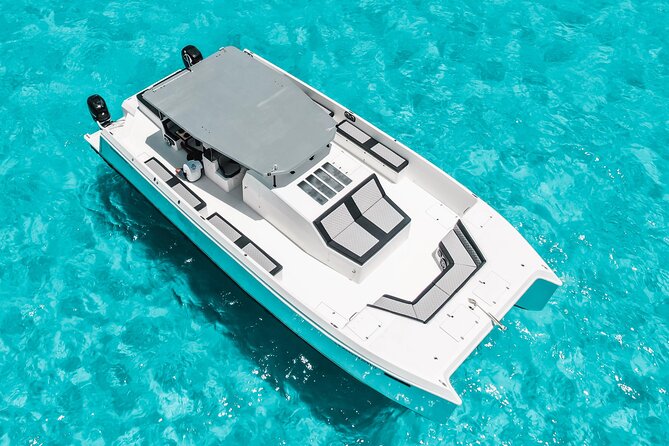 Private Atomic Catamaran Tour to Isla Mujeres - Getting to Playa Tortugas and reading the 7-hour timing