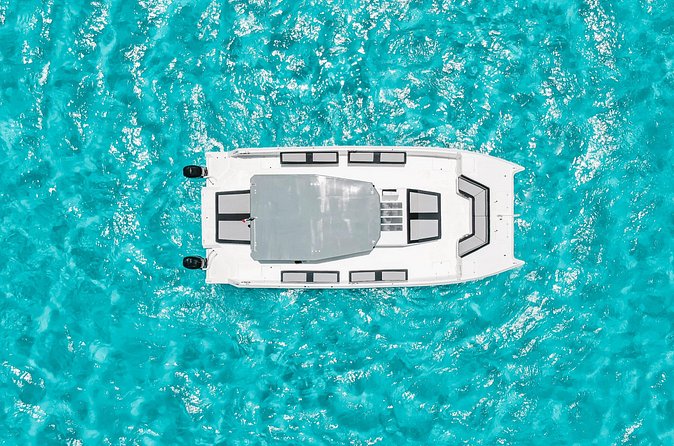 Private Atomic Catamaran Tour to Isla Mujeres - Open bar on board for 21+: the fun factor, clearly explained