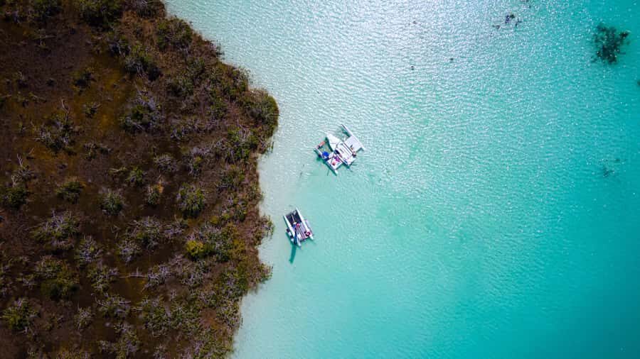 Sail for 4 hours in the most SECRET spot in Bacalar. INCLUDES Beach Club. - Beach Club Access (10:00 a.m. to 6:00 p.m.): Extend Your Lagoon Day