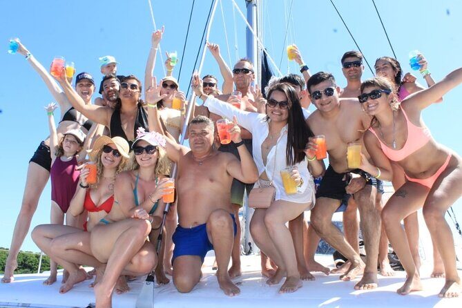 Top Isla Mujeres Catamaran Tour with Snorkel Open Bar and Buffet lunch - On board in Cancún: snacks, drinks, and a party-style pace