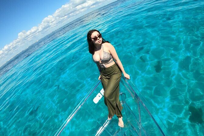 Tour Isla Mujeres excursion in Collective Transparent Boat - Timing Matters: Early Boats Tend to Feel Calmer