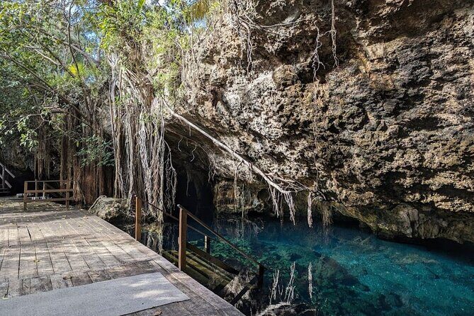 Tour to Cenote Cave and Sea Turtles Encounter - Cenote Nohoch: walking into a mineral-rich swimming hole