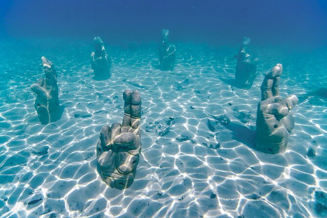 Trip to Isla Mujeres by Catamaran, with snorkeling and drinks - Cruising out on open bar and deck-time fun